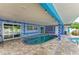 Cozy indoor pool with mosaic tile surround and tiled floor, offering a unique aquatic retreat at 2726 Desoto Rd, Sarasota, FL 34234