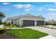 Beautiful single-story home with two-car garage, tile roof, and lush landscaping at 3204 Torta Ct, Bradenton, FL 34211