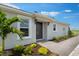 Inviting home with a well-kept landscape with healthy-looking shrubs and stone walkway at 3204 Torta Ct, Bradenton, FL 34211