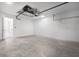 A spacious, bright garage with white-painted brick walls and access door at 3204 Torta Ct, Bradenton, FL 34211