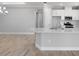 Bright kitchen with stainless steel appliances, white cabinets, and a center island at 3204 Torta Ct, Bradenton, FL 34211