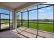 Screened-in lanai with brick flooring overlooks the water view at 3204 Torta Ct, Bradenton, FL 34211