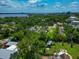 Scenic aerial view featuring verdant trees, residential streets, and glimpses of the waterfront in the background at 326 25Th W St, Bradenton, FL 34205