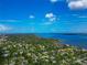 Expansive aerial view of the waterfront community with homes nestled among mature trees at 326 25Th W St, Bradenton, FL 34205