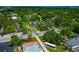 Aerial view of a charming neighborhood with tree-lined streets and a glimpse of the bay at 326 25Th W St, Bradenton, FL 34205