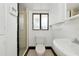 This small bathroom boasts a tiled shower, a modern toilet, and classic design to enhance the functionality at 326 25Th W St, Bradenton, FL 34205