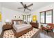 Stylish bedroom features wood furniture, natural light, and decorative accents that enhance the room's charm at 326 25Th W St, Bradenton, FL 34205