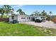View of a white house with driveway, carport and garage at 326 25Th W St, Bradenton, FL 34205