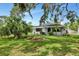 Charming home with brick facade, well-manicured lawn, landscaping and wrought iron details in a lush, mature setting at 326 25Th W St, Bradenton, FL 34205