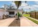 View of the side and back of the house with stainless steel grill at 326 25Th W St, Bradenton, FL 34205