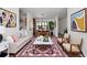 Bright living room and dining room boasts modern decor and neutral colors, creating an inviting and open space at 326 25Th W St, Bradenton, FL 34205