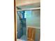 Bathroom shower with tile surround, shower caddy, and a frosted glass sliding door at 3407 Avenida Madera # A, Bradenton, FL 34210