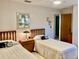 Bedroom featuring two twin beds with matching wood headboards and nightstand at 3407 Avenida Madera # A, Bradenton, FL 34210