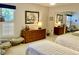 Bedroom featuring two twin beds and mirrored closet with built-in dresser at 3407 Avenida Madera # A, Bradenton, FL 34210
