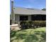 Exterior of home featuring a well-manicured lawn and lush greenery at 3407 Avenida Madera # A, Bradenton, FL 34210