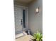 Inviting front entrance with a decorative door, stylish light fixture, and a charming bunny statue at 3407 Avenida Madera # A, Bradenton, FL 34210
