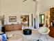 Spacious living area with high ceilings, lots of natural light, and stylish mid-century modern furniture at 3407 Avenida Madera # A, Bradenton, FL 34210