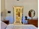 Spacious bedroom showcasing a walk-through closet leading to the main bathroom at 3407 Avenida Madera # A, Bradenton, FL 34210