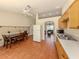 Inviting kitchen with stainless steel sink, dining table, open layout and natural light at 3698 N Chamberlain Blvd, North Port, FL 34286
