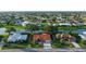 Bird's eye view showcasing a home with lush landscaping, well-maintained lawns, and a peaceful neighborhood setting at 387 Eden Dr Dr, Englewood, FL 34223