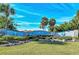 The Englewood Isles community entrance features a beautifully landscaped sign with stone accents and lush greenery at 387 Eden Dr Dr, Englewood, FL 34223
