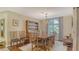 Elegant dining room featuring hardwood floors, a large window, and a decorative china cabinet at 387 Eden Dr Dr, Englewood, FL 34223