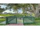 Charming dock overlooking the water, surrounded by lush greenery and a tranquil setting at 387 Eden Dr Dr, Englewood, FL 34223