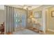 Bright foyer featuring a patterned rug, natural light, and a decorative console table at 387 Eden Dr Dr, Englewood, FL 34223