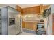 Garage features a stainless steel refrigerator and built-in storage cabinets with a workbench area at 387 Eden Dr Dr, Englewood, FL 34223