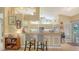Bright eat-in kitchen with breakfast bar featuring seating and views to the backyard at 387 Eden Dr Dr, Englewood, FL 34223