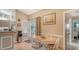 Eat-in kitchen features wood table with four chairs, tile floors, and access to the backyard at 387 Eden Dr Dr, Englewood, FL 34223