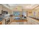 Bright eat-in kitchen with stainless steel appliances and a large island with bar seating at 387 Eden Dr Dr, Englewood, FL 34223