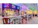 Well-equipped tiki bar with neon signs, seating and outdoor entertaining area at 387 Eden Dr Dr, Englewood, FL 34223