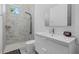 Modern bathroom with sleek vanity, updated fixtures, and tiled shower at 4035 Bay Shore Rd, Sarasota, FL 34234