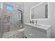 Bright bathroom features marble-tiled shower and a sleek vanity at 4035 Bay Shore Rd, Sarasota, FL 34234