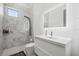 Contemporary bathroom with sleek vanity, modern fixtures, and marble tiled shower at 4035 Bay Shore Rd, Sarasota, FL 34234