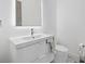 Clean bathroom with under-mount sink, modern fixtures, and great lighting at 4035 Bay Shore Rd, Sarasota, FL 34234