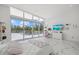 Bright bedroom featuring a large sliding glass door to a private terrace at 4035 Bay Shore Rd, Sarasota, FL 34234