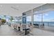 Dining area with seating for ten and views of the kitchen and water at 4035 Bay Shore Rd, Sarasota, FL 34234