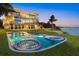 Stunning waterfront home with a luxurious pool, hot tub, and spacious outdoor lounging area at 4035 Bay Shore Rd, Sarasota, FL 34234