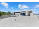 Exterior view from an expansive terrace overlooking the home's architectural design at 4035 Bay Shore Rd, Sarasota, FL 34234