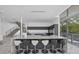 Open kitchen with a large island with seating, stainless appliances, and plenty of counter space at 4035 Bay Shore Rd, Sarasota, FL 34234