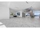 Spacious living area with marble flooring, sleek design, and an open staircase at 4035 Bay Shore Rd, Sarasota, FL 34234