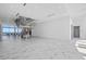 Spacious modern living room featuring marble floors, a striking staircase, and views at 4035 Bay Shore Rd, Sarasota, FL 34234