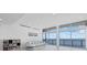 Bright living room with waterfront views, tile floors, and modern lighting at 4035 Bay Shore Rd, Sarasota, FL 34234