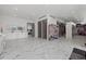 Expansive main bathroom featuring dual vanity, marble floors and custom walk-in closet at 4035 Bay Shore Rd, Sarasota, FL 34234