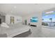 Bright main bedroom with marble floors, beach view, and media center at 4035 Bay Shore Rd, Sarasota, FL 34234