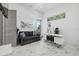 Modern office with marble floors, a picture window, and a comfortable sitting area at 4035 Bay Shore Rd, Sarasota, FL 34234