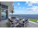 Waterfront patio with comfortable seating and stunning panoramic views of the water at 4035 Bay Shore Rd, Sarasota, FL 34234