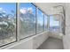 Modern shower with a rain shower head and large picture window displaying scenic views at 4035 Bay Shore Rd, Sarasota, FL 34234